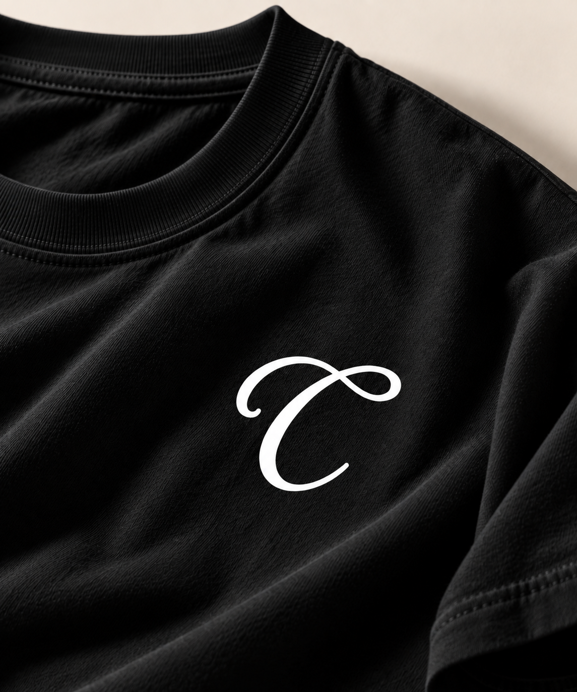 Close-up: Black San Diego Tee close-up – Caston C chest mark
